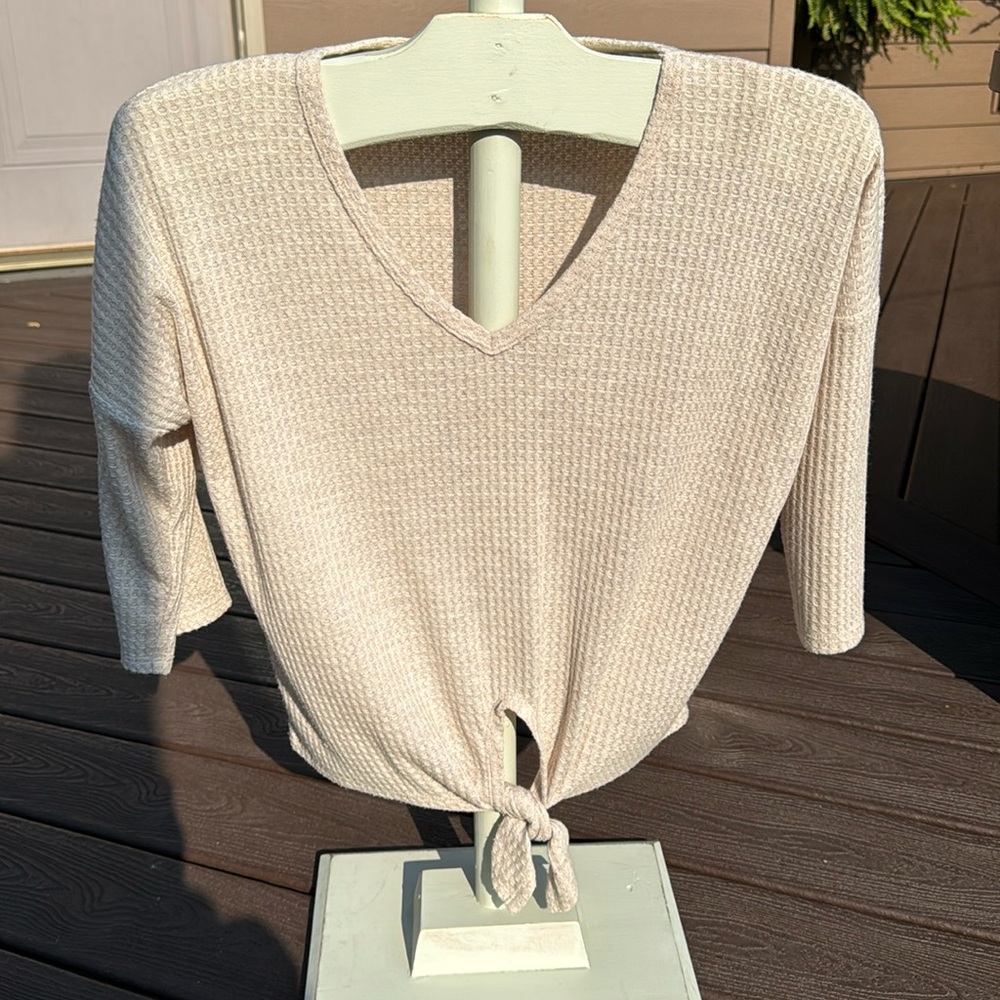 Gypsies cream top.  Long sleeve with tie front